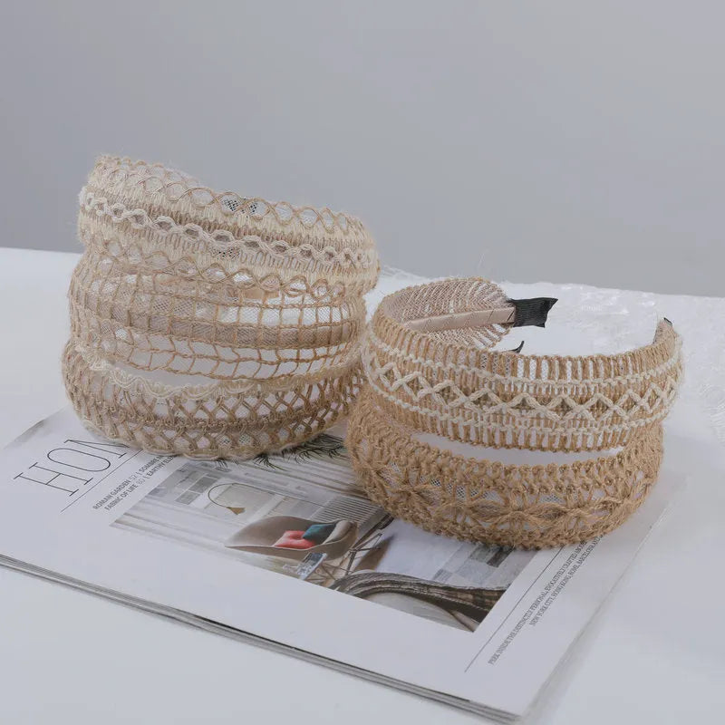 Bamboo woven wide brim hair band in black with bend and hitch details, side view on plain background
