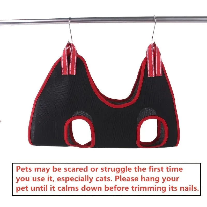 A grey polyester mesh pet grooming hammock restraint bag hanging from hooks, with sizes S, M, L, XS shown.