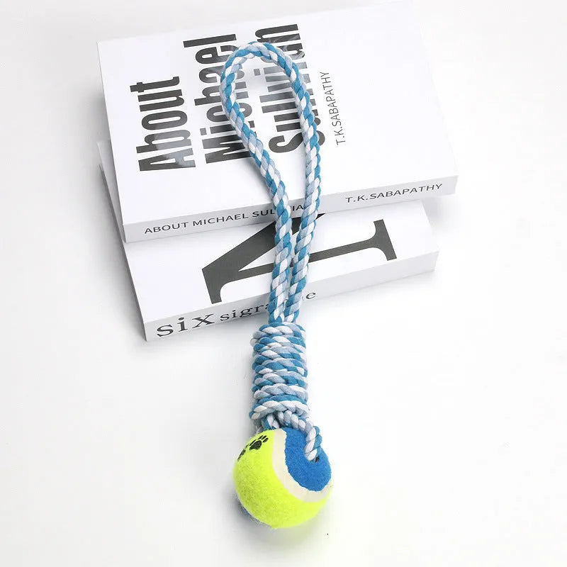 Red and white cotton rope tug toy for dogs, approximately 38cm long, laid out straight.