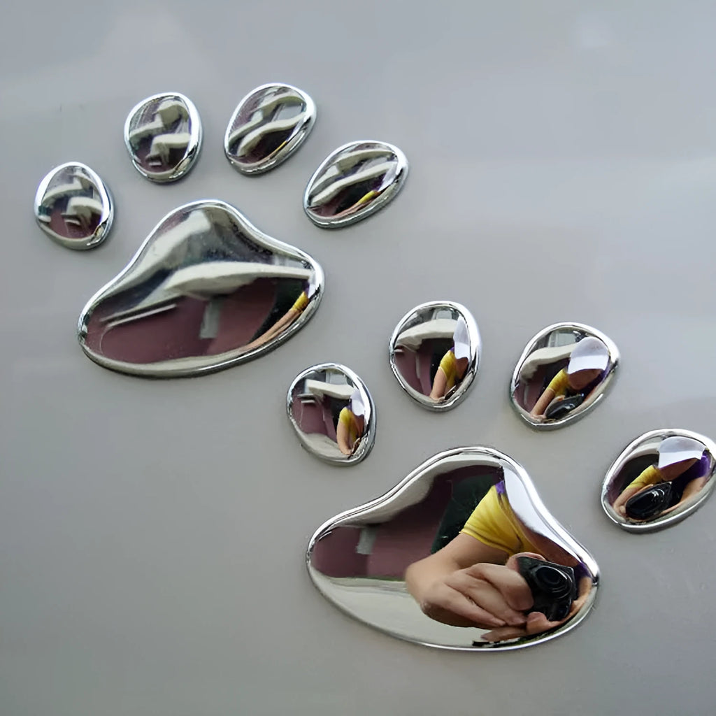 Pair of 7cm long PVC car stickers with a hand-shaped brush and dog footprints design in black, red, silver, and gold colour options.