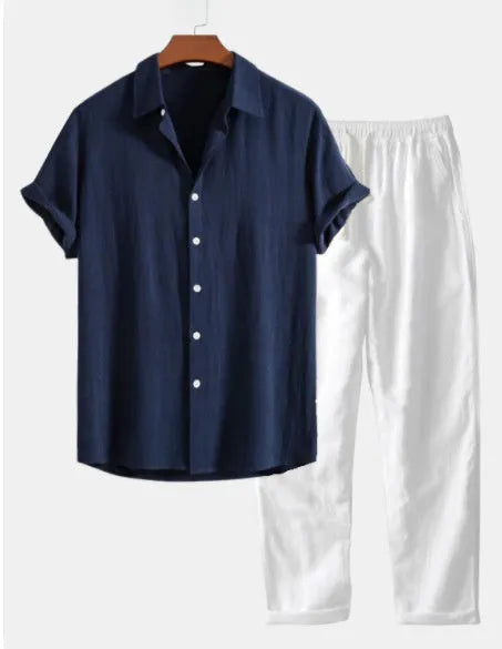 Casual loose navy blue cotton linen short sleeve suit with matching shorts, glasses, shoes, and watch.