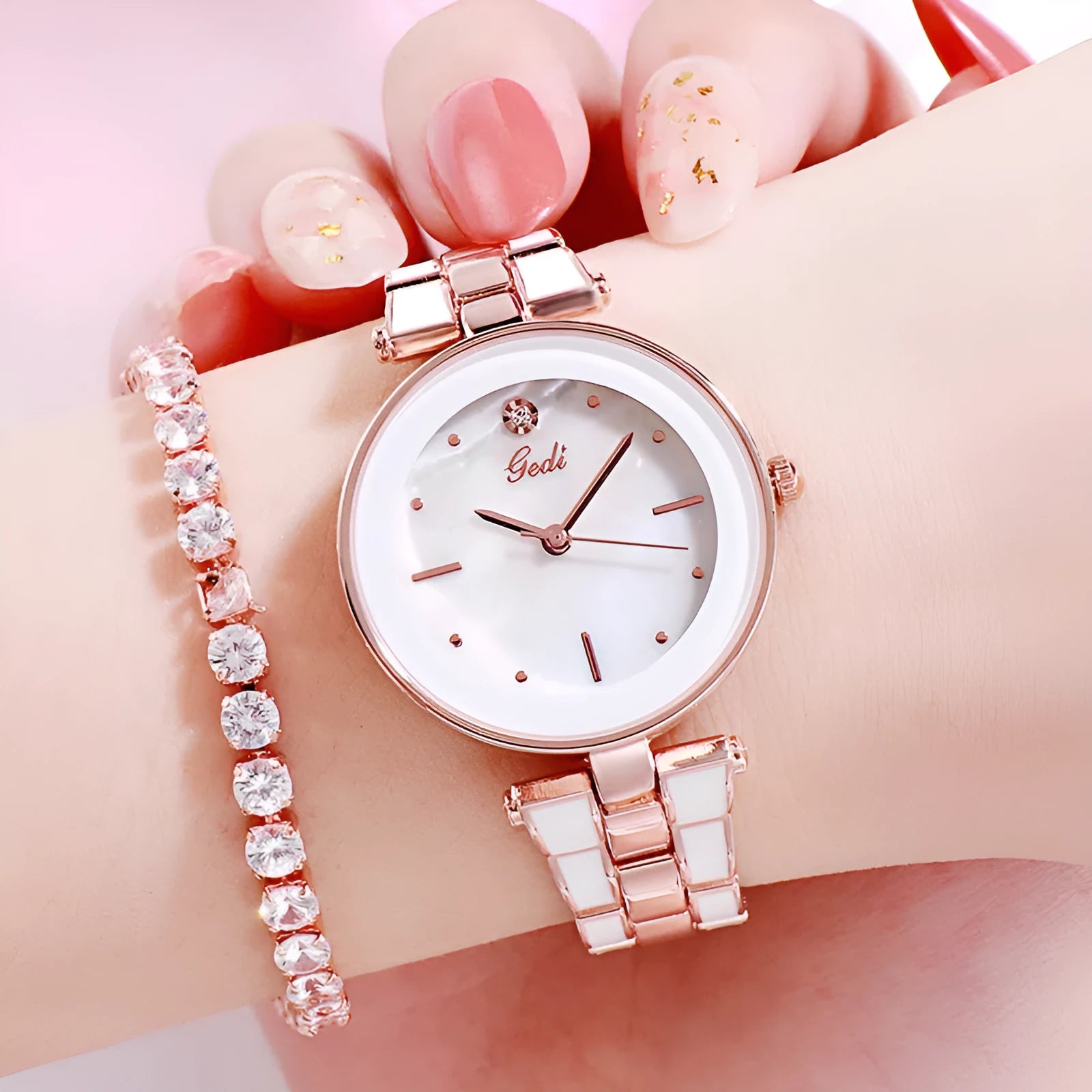 Ladies quartz watch with white round dial, steel strap, and rose gold sheen on a plain background