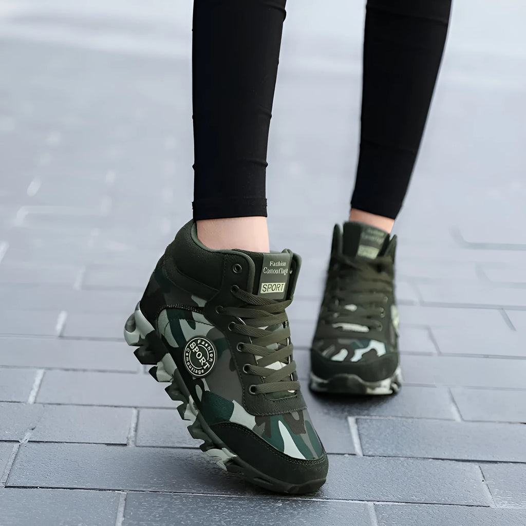 Women's green camouflage canvas sneakers with rubber soles showing side view
