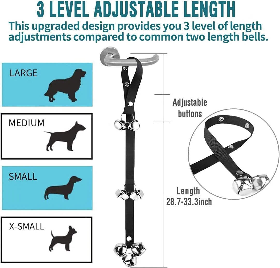 Silver metal dog training bells on an adjustable nylon leash hanging from a door handle