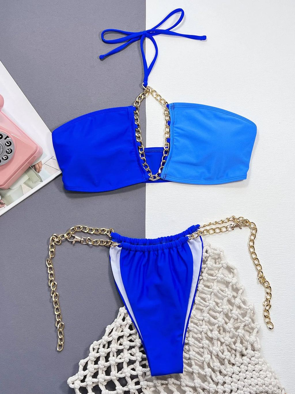 Solid blue women's two-piece nylon bikini swimsuit on a white background.