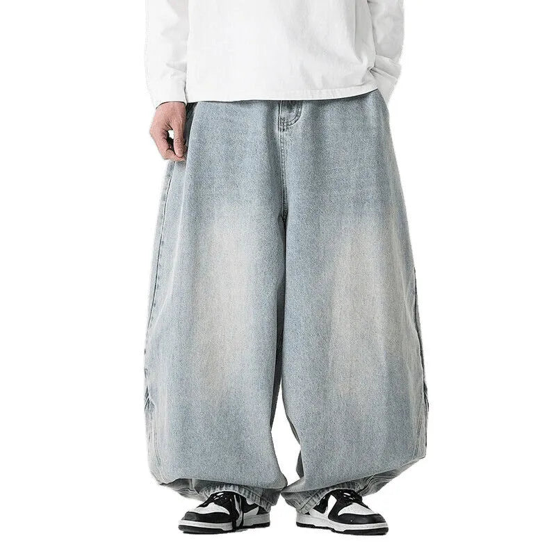 Men's loose-fit straight leg jeans in black denim on a hanger.