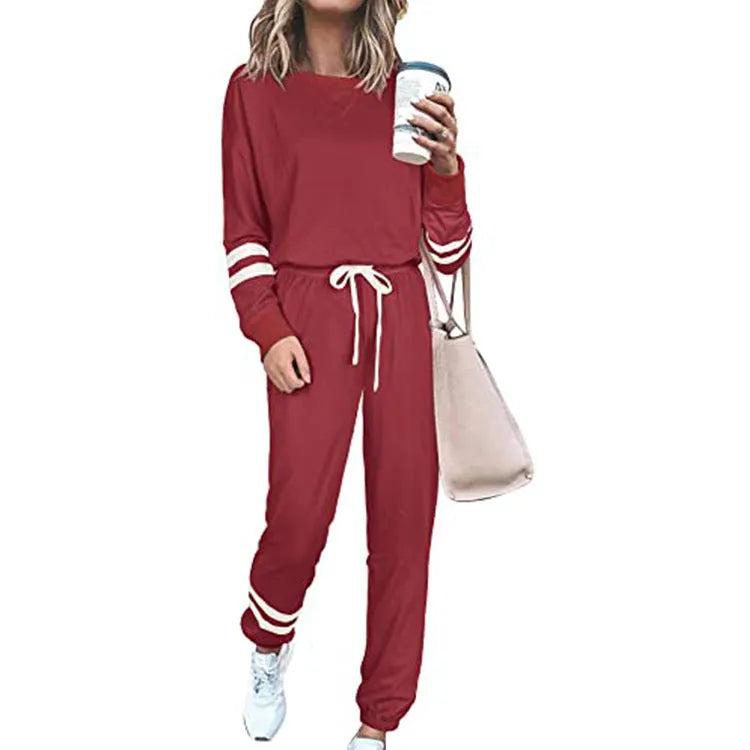 Women's plus size loose-fitting casual suit set in a solid colour with half-length sleeves.