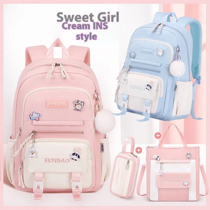 Pink waterproof school backpack for girls with curved straps, shown with matching pencil case and bag.