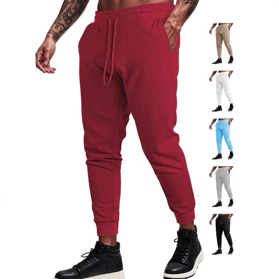 Men's casual loose solid colour drawstring pants in waffle knit polyester, front view