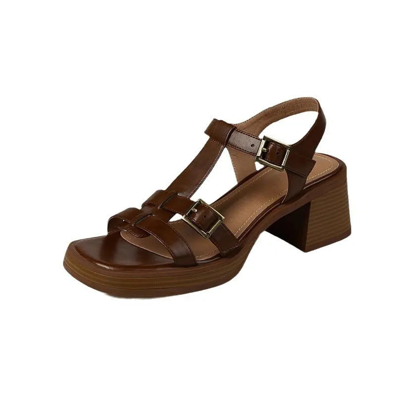 Women's black retro sandals with a T-shaped buckle, open square toe, platform, and chunky heel.