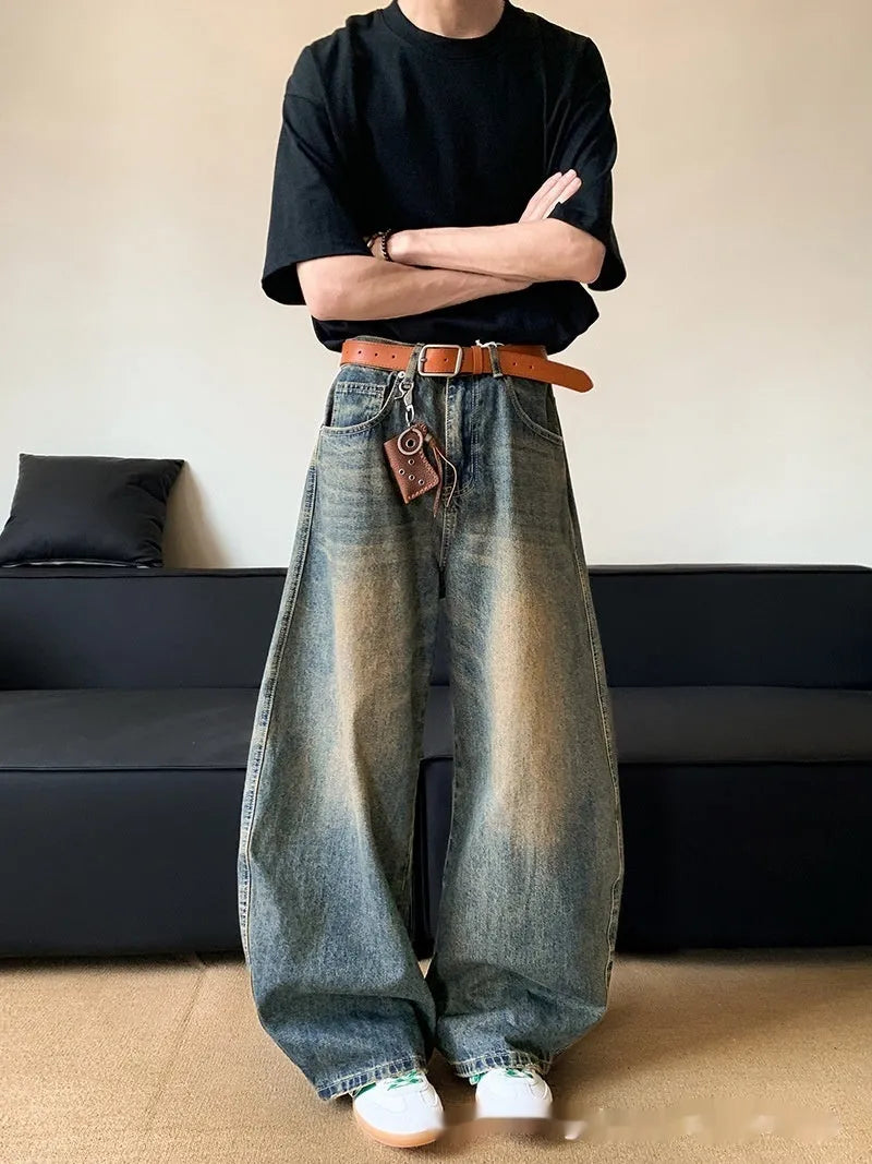 Men's retro blue distressed machete denim jeans with wide-leg silhouette and slim hip fit