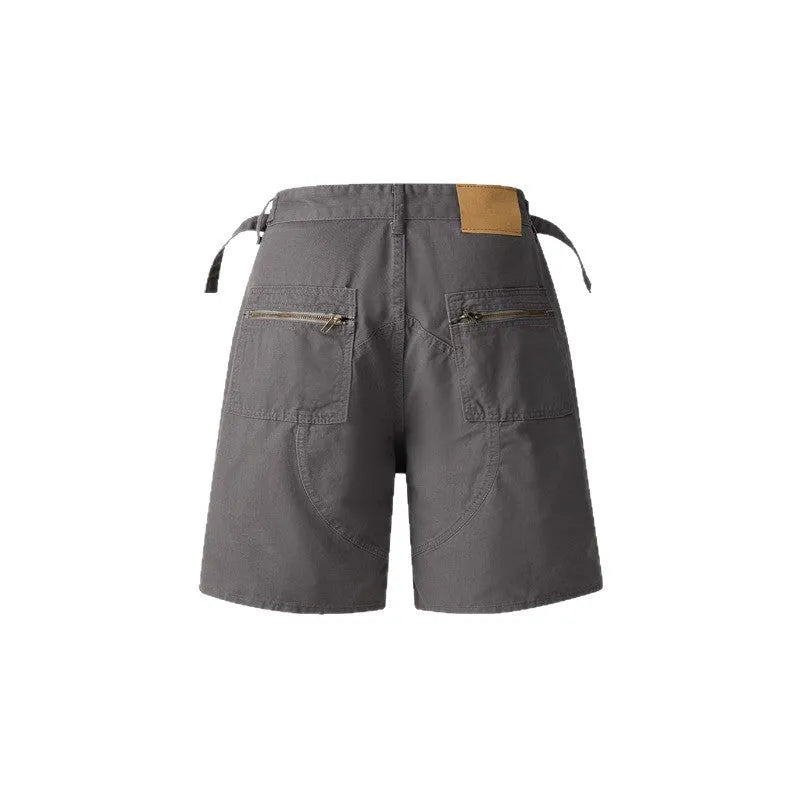 Retro loose fit washed cotton workwear shorts in grey, shown with half elastic waistband and fifth pants length.