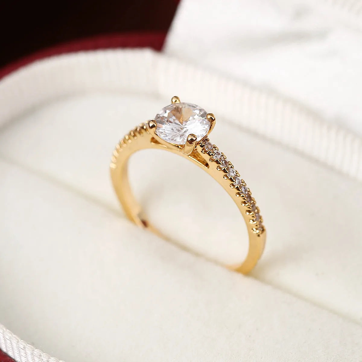 Hexagonal geometric zircon ring in copper with electroplated finish showing angular design and zircon stone