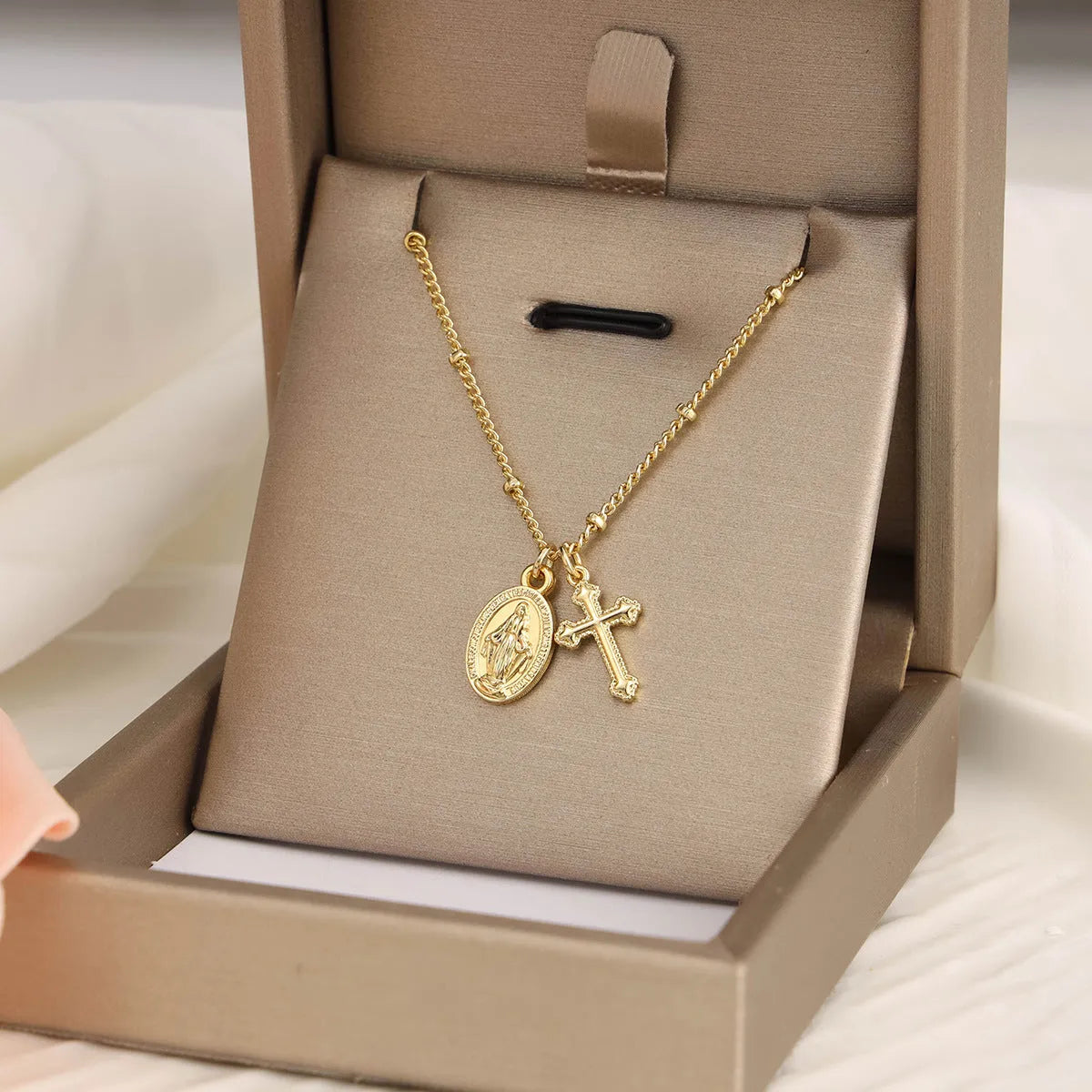 Gold geometric cross necklace with Virgin Mary ornament for women