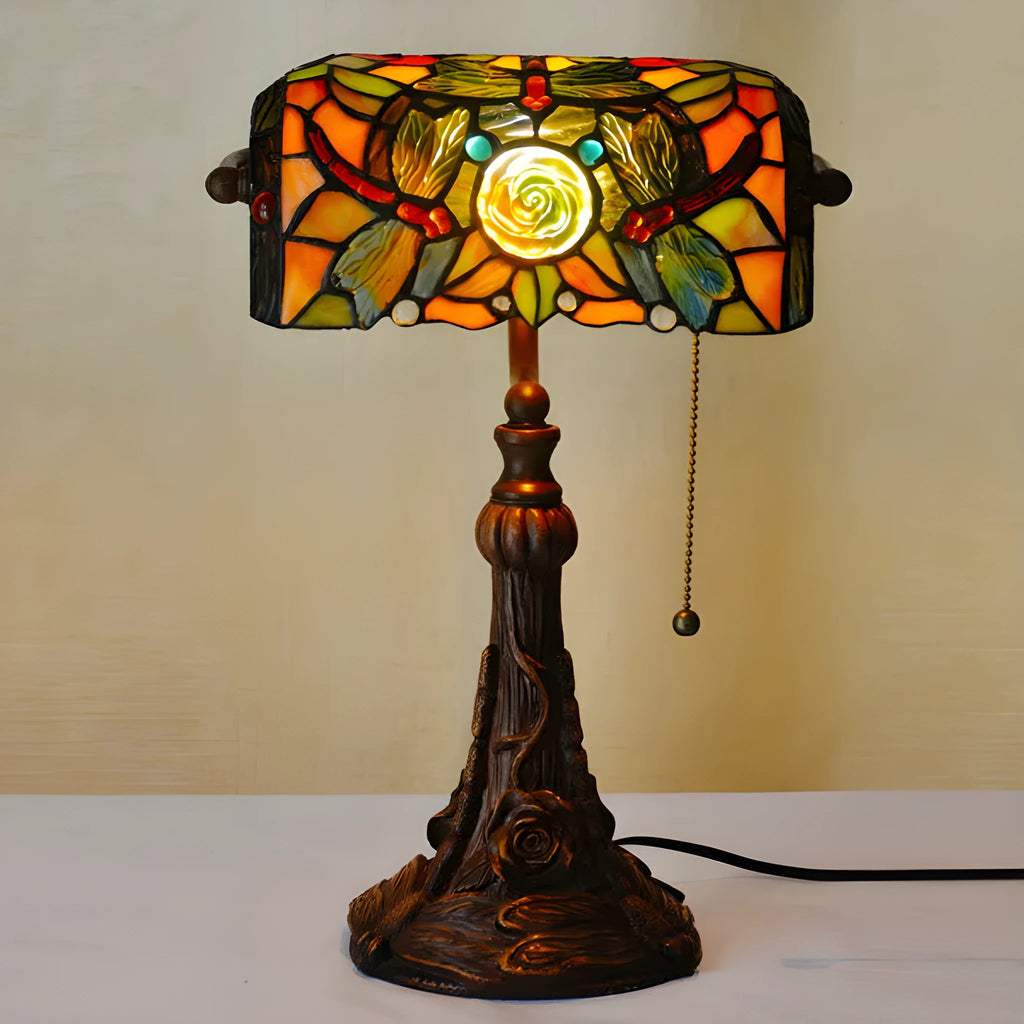 Tiffany table lamp with coloured glass shade on resin base, 36cm tall