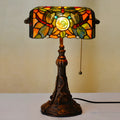 Tiffany table lamp with coloured glass shade on resin base, 36cm tall