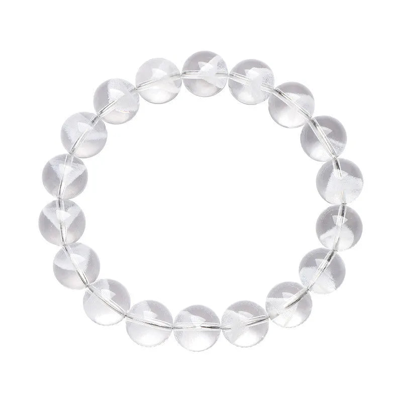 Women's white crystal pyramid bead bracelet with a silver ruyi charm on a white background.
