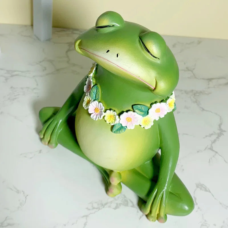 Magic Yoga Frog home ornament in RDW123 colour on a wooden shelf.