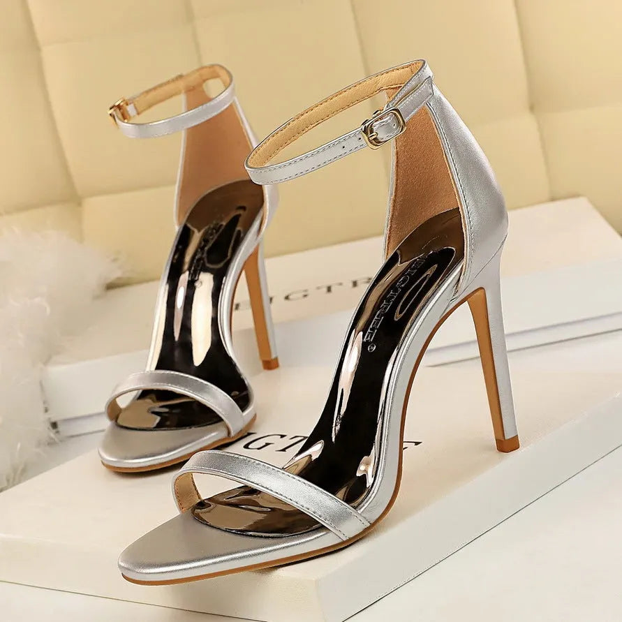 Women's open toe high heels with an ankle strap buckle in six colour options.