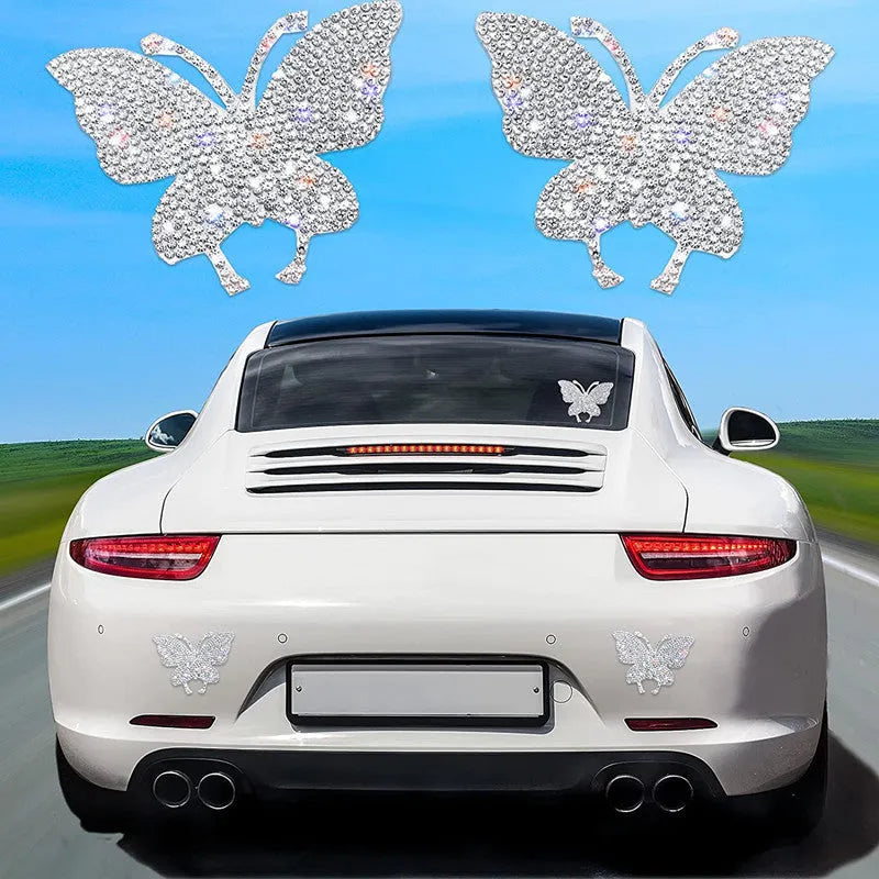 White diamond butterfly and bear claw design glass car sticker measuring 7 by 6 centimetres.