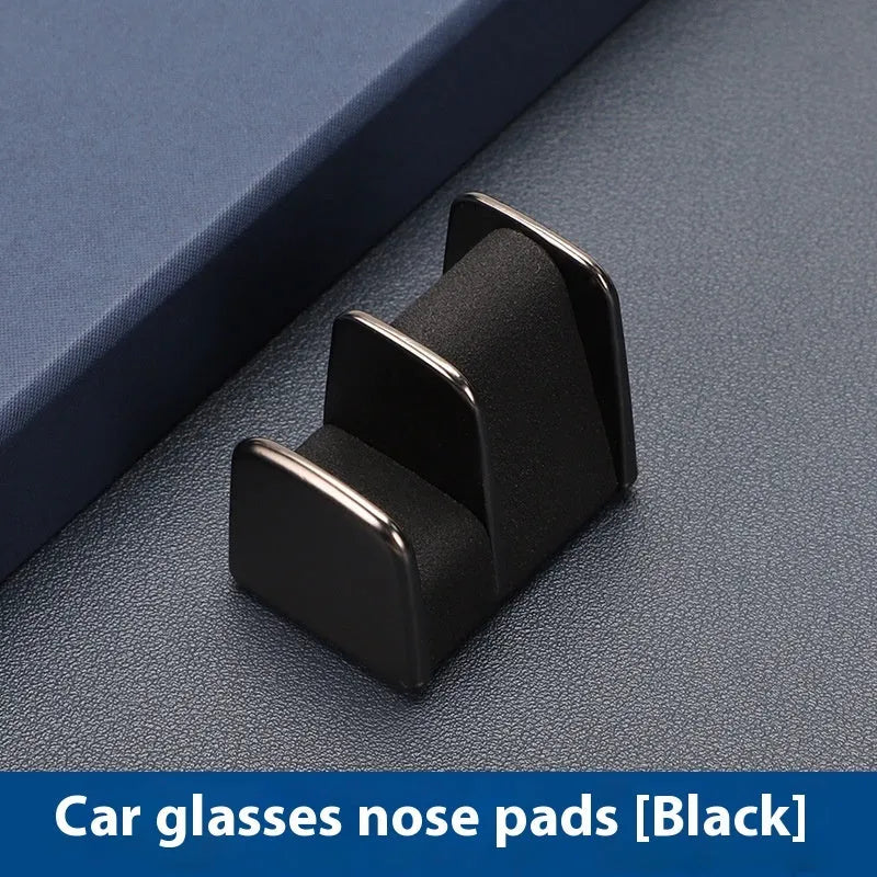 Compact zinc alloy and leather glasses clip for car dashboard, shown in available colours.