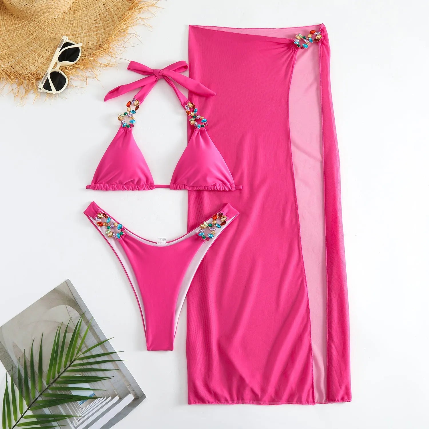 Rose Red three-piece swimsuit set with bikini top, bottoms, and long mesh skirt laid flat.
