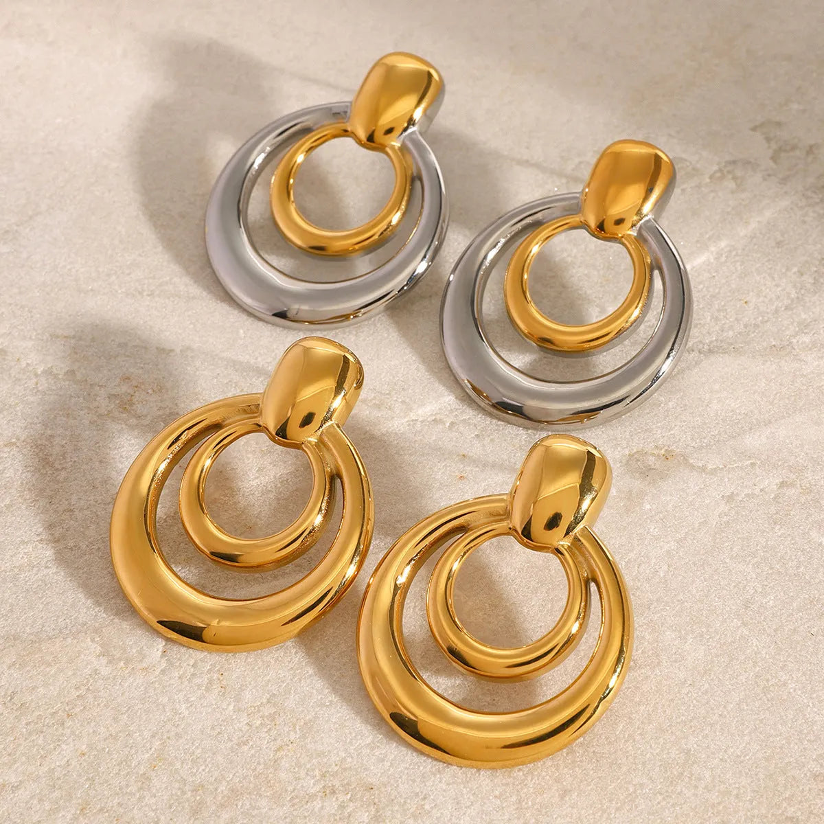Gold-plated double layer hollow stud earrings with round geometric design