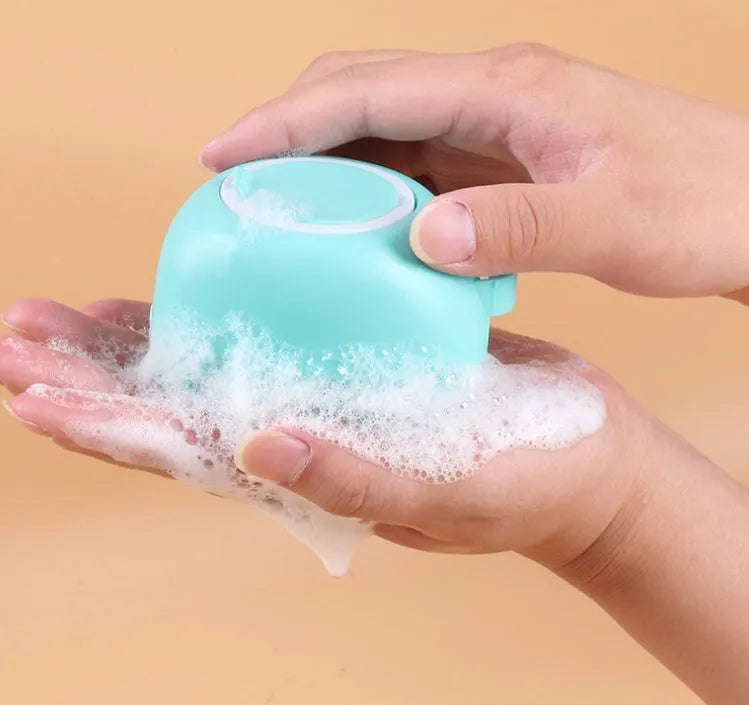 Blue silicone dog bath brush with soft bristles for pet grooming and shampoo application