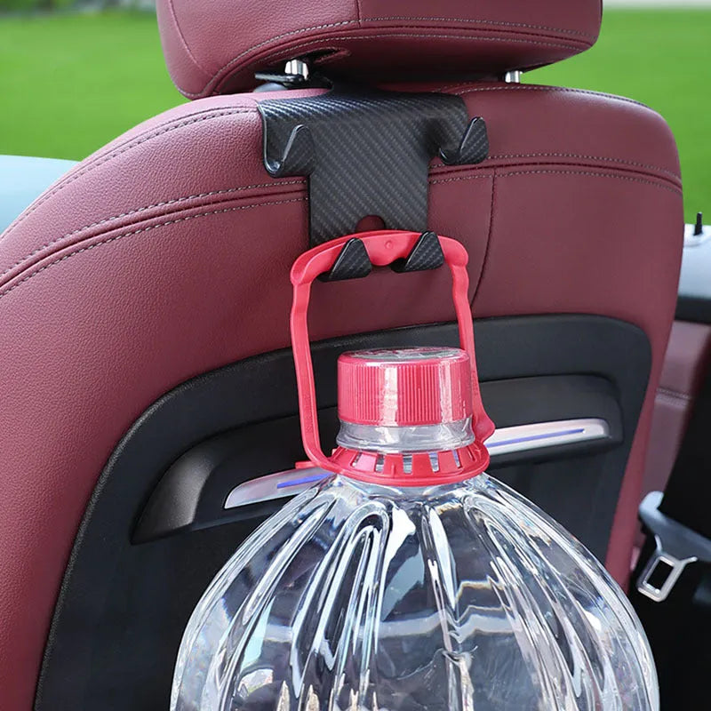 Black ABS car multifunction hook with carbon fibre pattern and integrated phone bracket for rear seat storage.