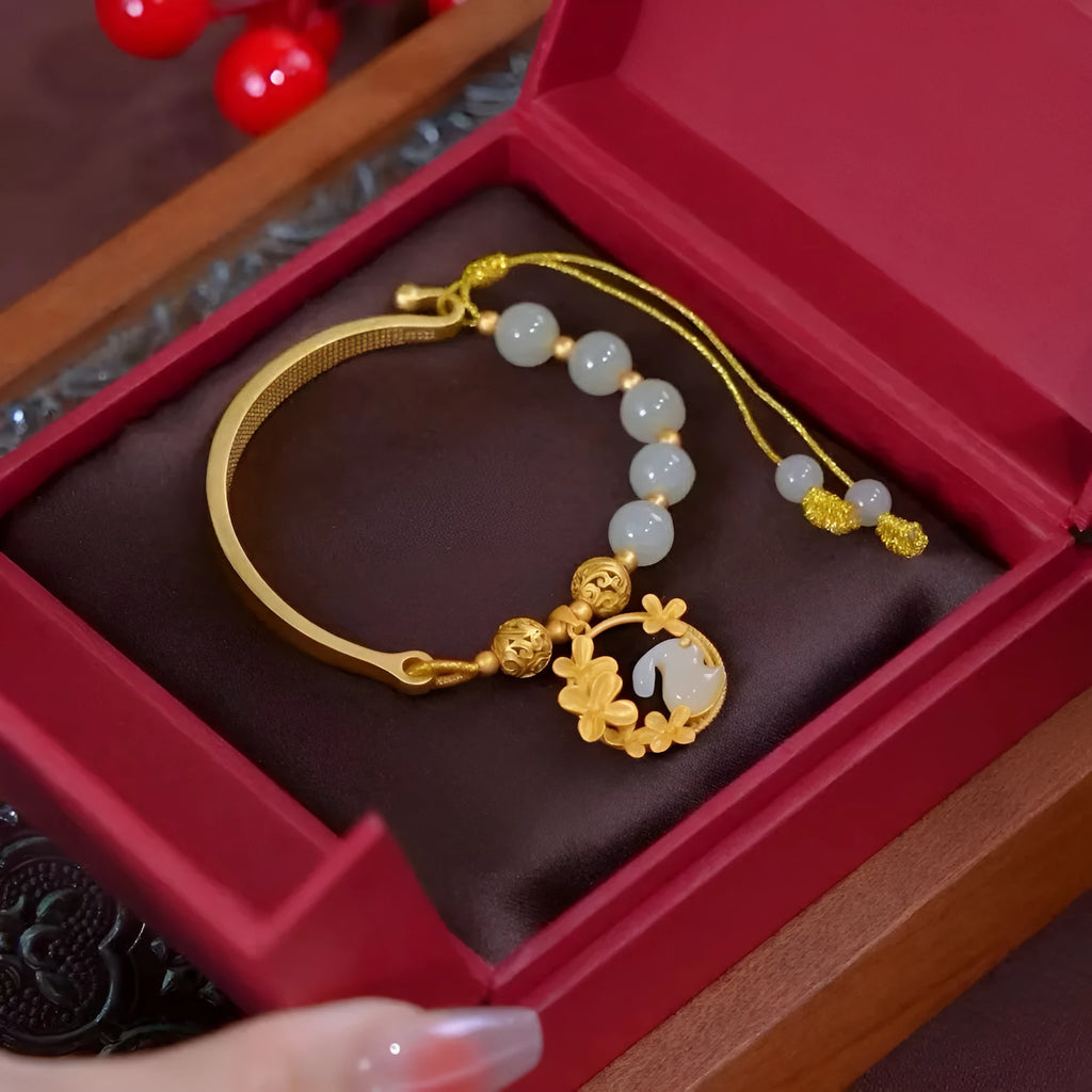 Fashion adjustable bracelet with antique hydrangea pendant, coloured glaze beads, and rabbit motif on a white background