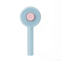 Blue pet grooming brush with self-cleaning button and angled metal needles