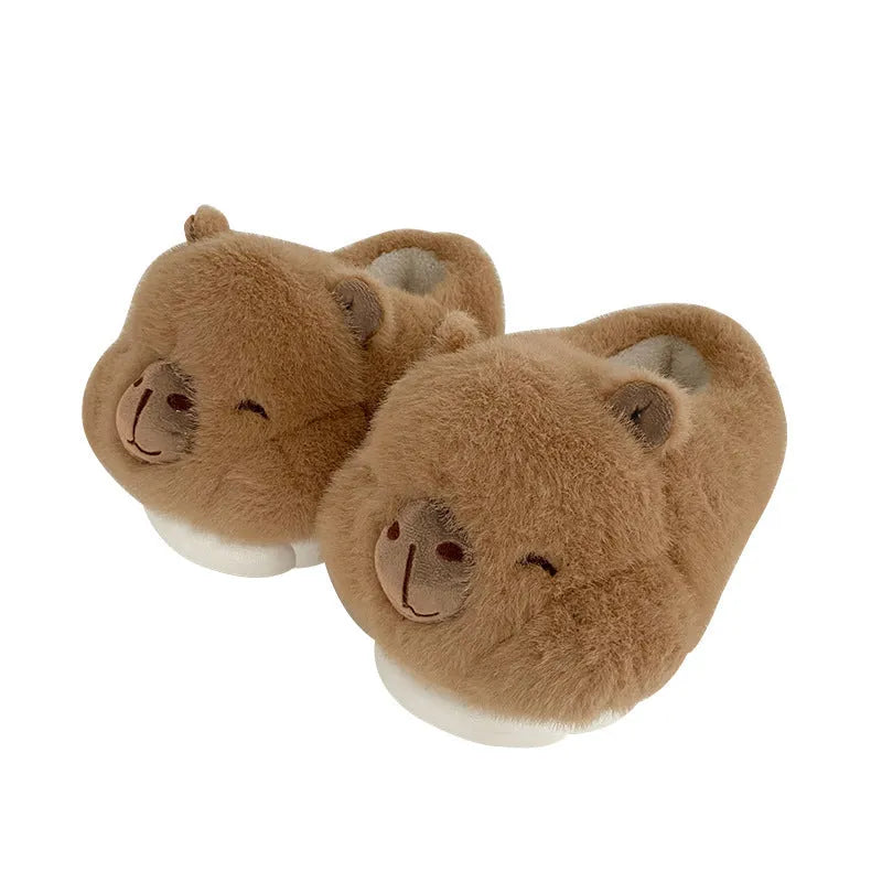 Light brown women's winter plush slippers with a cartoon pattern, round toe, and a pull-on oversleeve design.