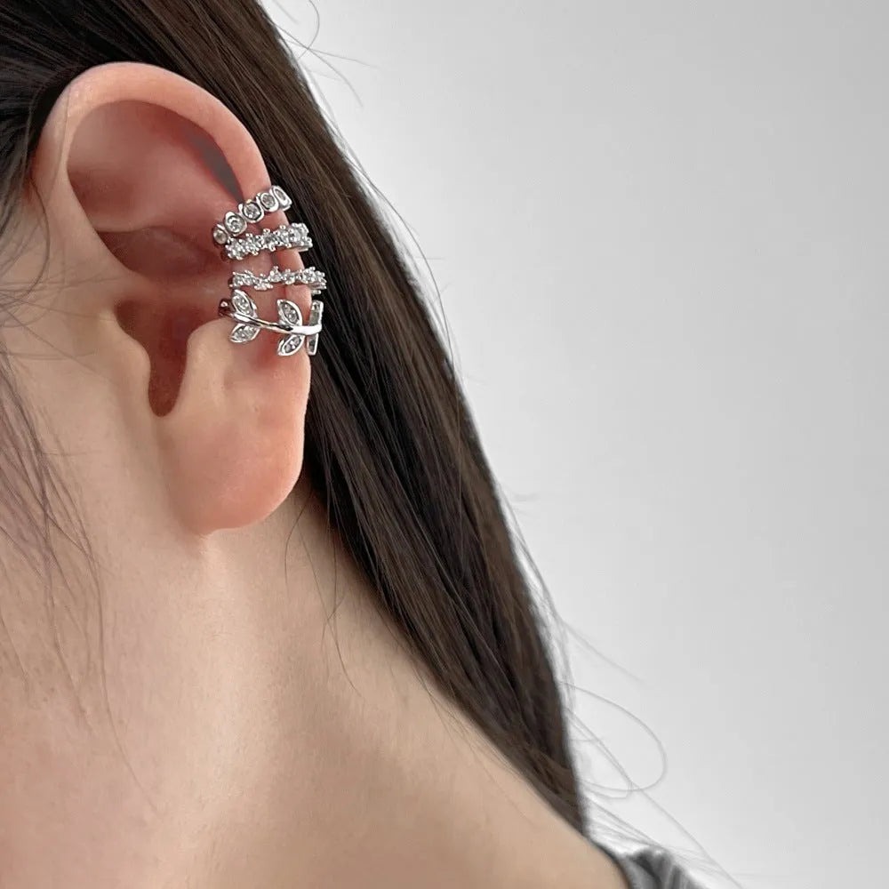 Sterling silver ear clip with leaf shape and zircon inlay in gold electroplated finish for women
