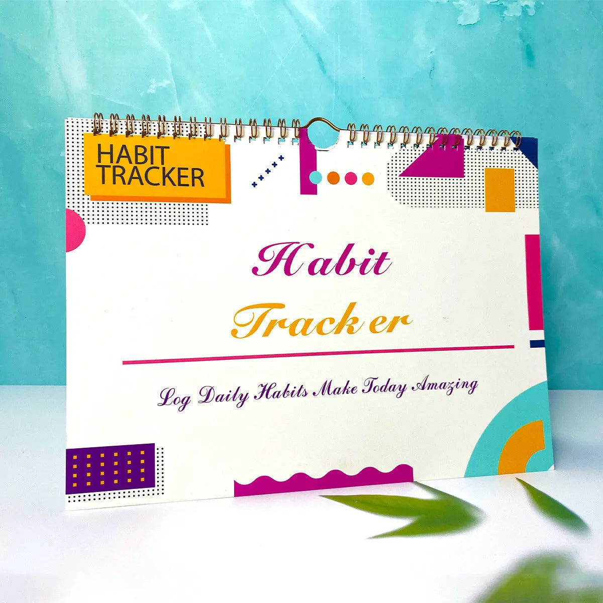 A4 habit tracking planner showing pink white cover with 12 internal pages for schedule recording
