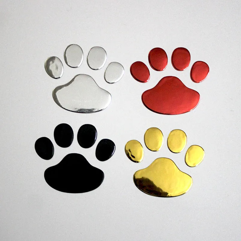 Pair of 7cm long PVC car stickers with a hand-shaped brush and dog footprints design in black, red, silver, and gold colour options.