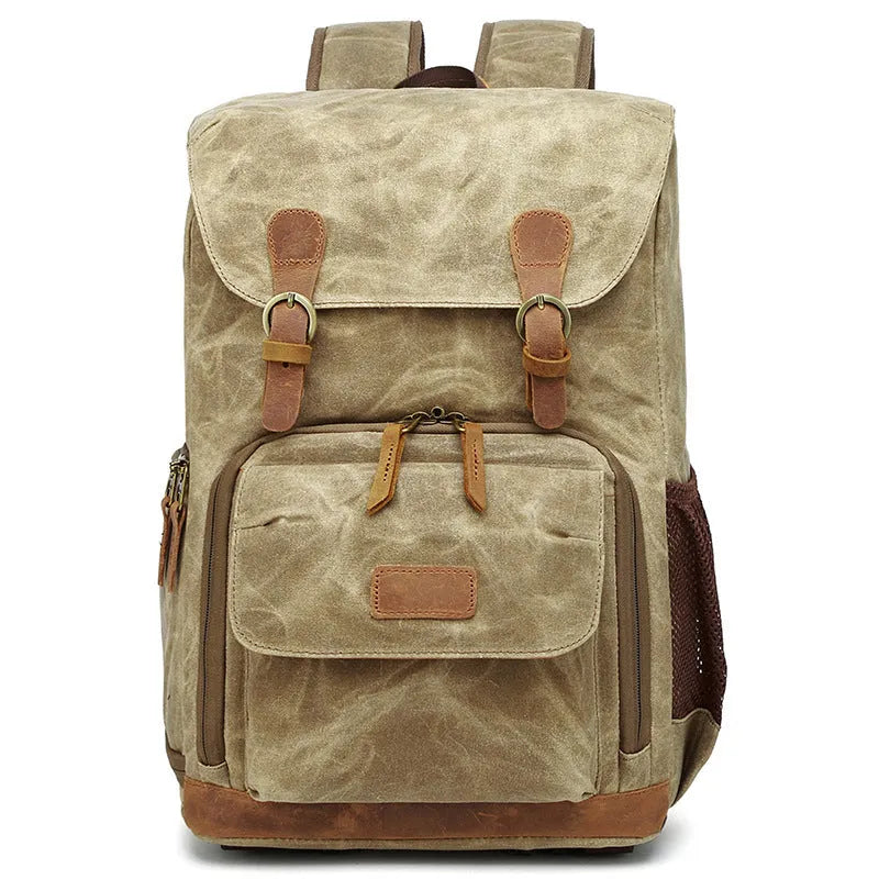 Grey black canvas backpack style DSLR camera bag with straps and zips