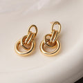 Gold geometric earrings with irregular asymmetric design and INS high-profile styling