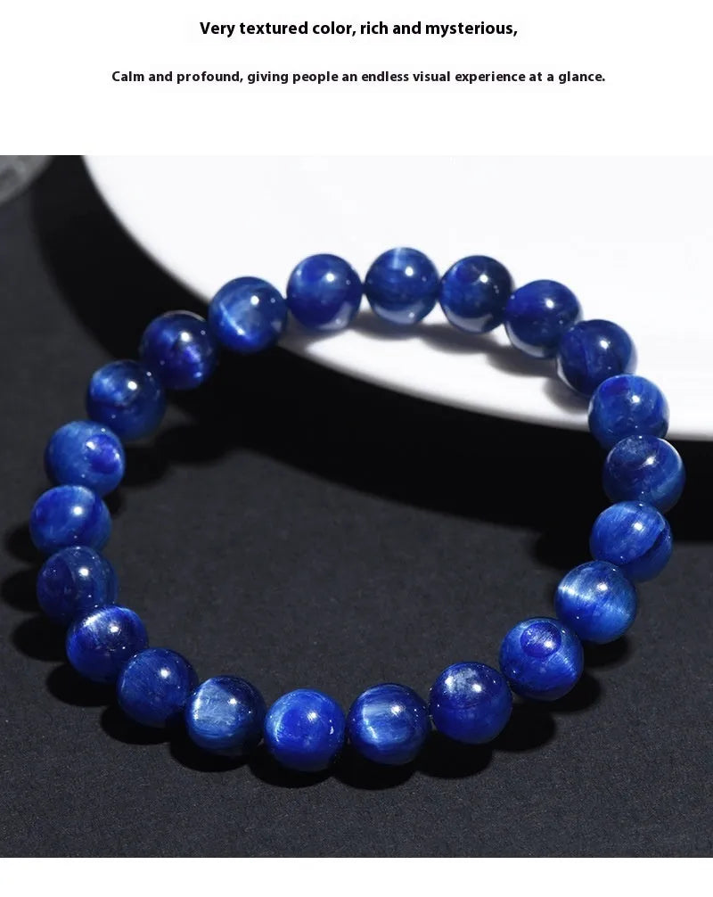 Geometric Ruyi design blue crystal ball bracelet with polished beads on a white background.
