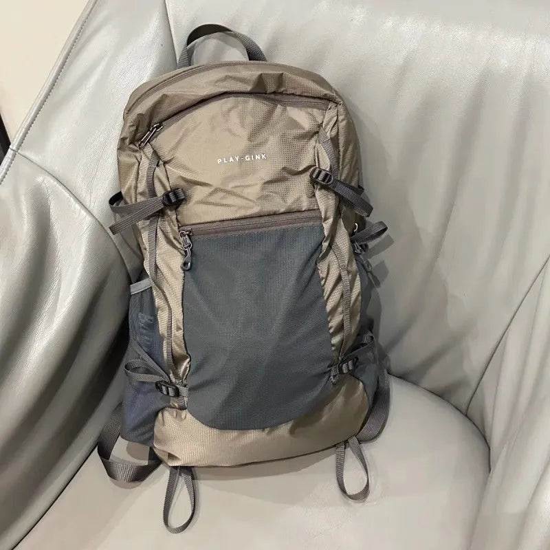 Natural revival khaki light solid colour nylon backpack with contrast details and curved shoulder straps