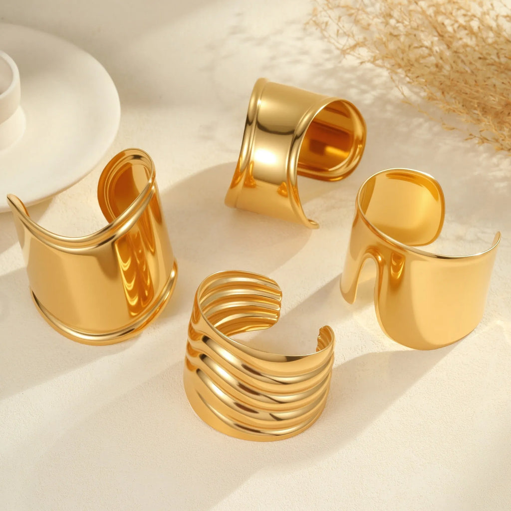 Women's gold plated stainless steel wide bracelet with wave geometric asymmetric design