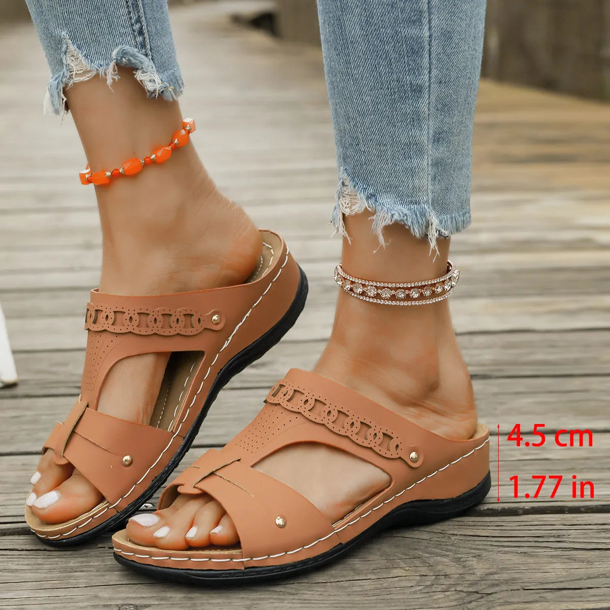 Slope heel roman style slippers with fish mouth toe holder in various colours on a rubber sole.