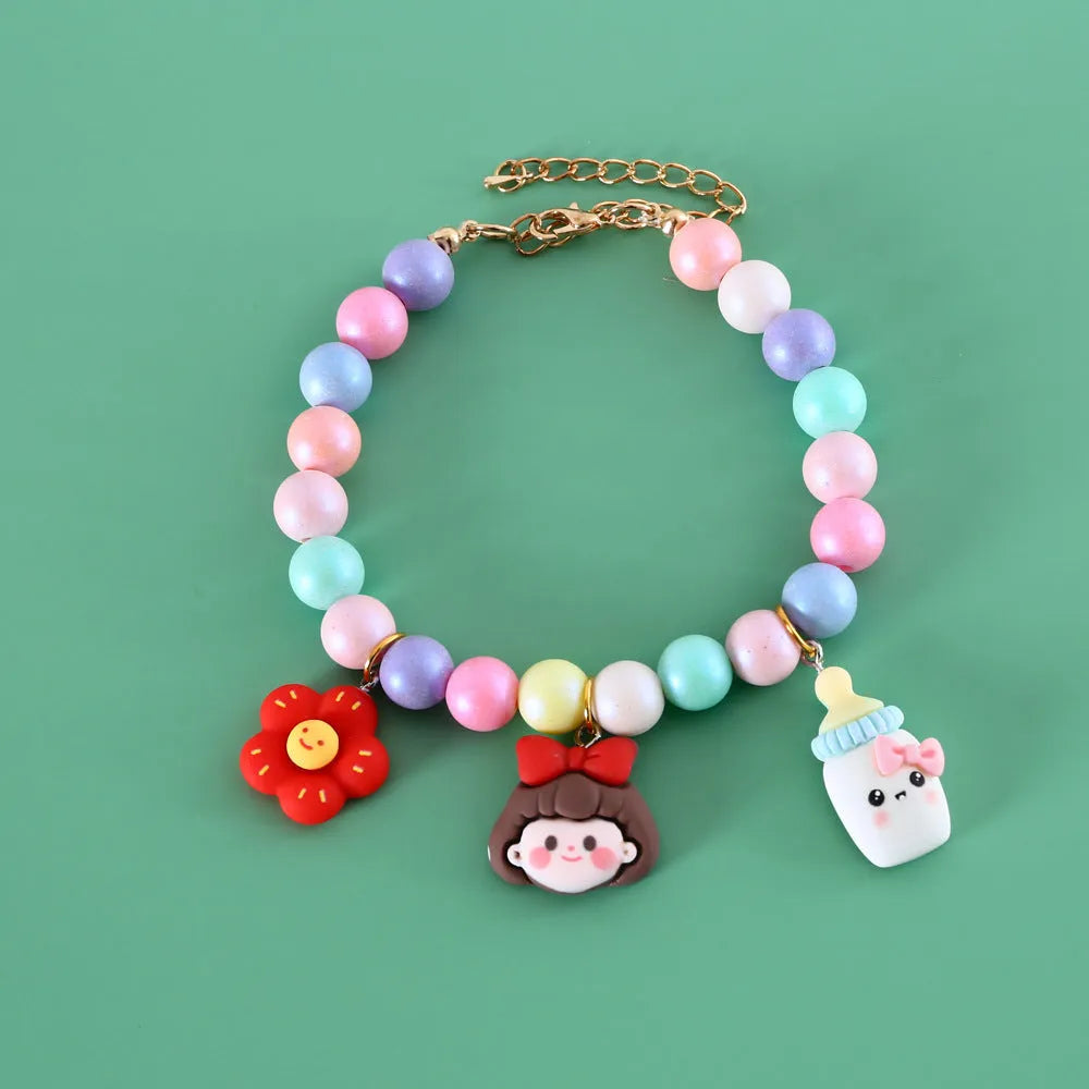 Macaron-themed pet collar accessories in resin with adjustable sizing options