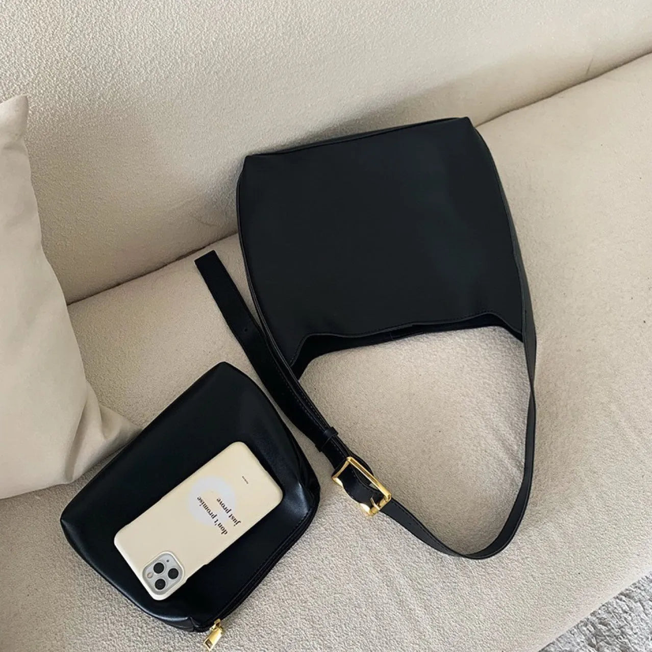 Women's soft PU shoulder bag with swing threads decoration in black or brown colour