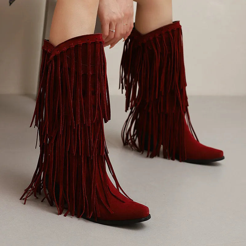 Women's suede knee-high boots with a chunky heel, square toe, and tassel detail on a waterproof platform sole.