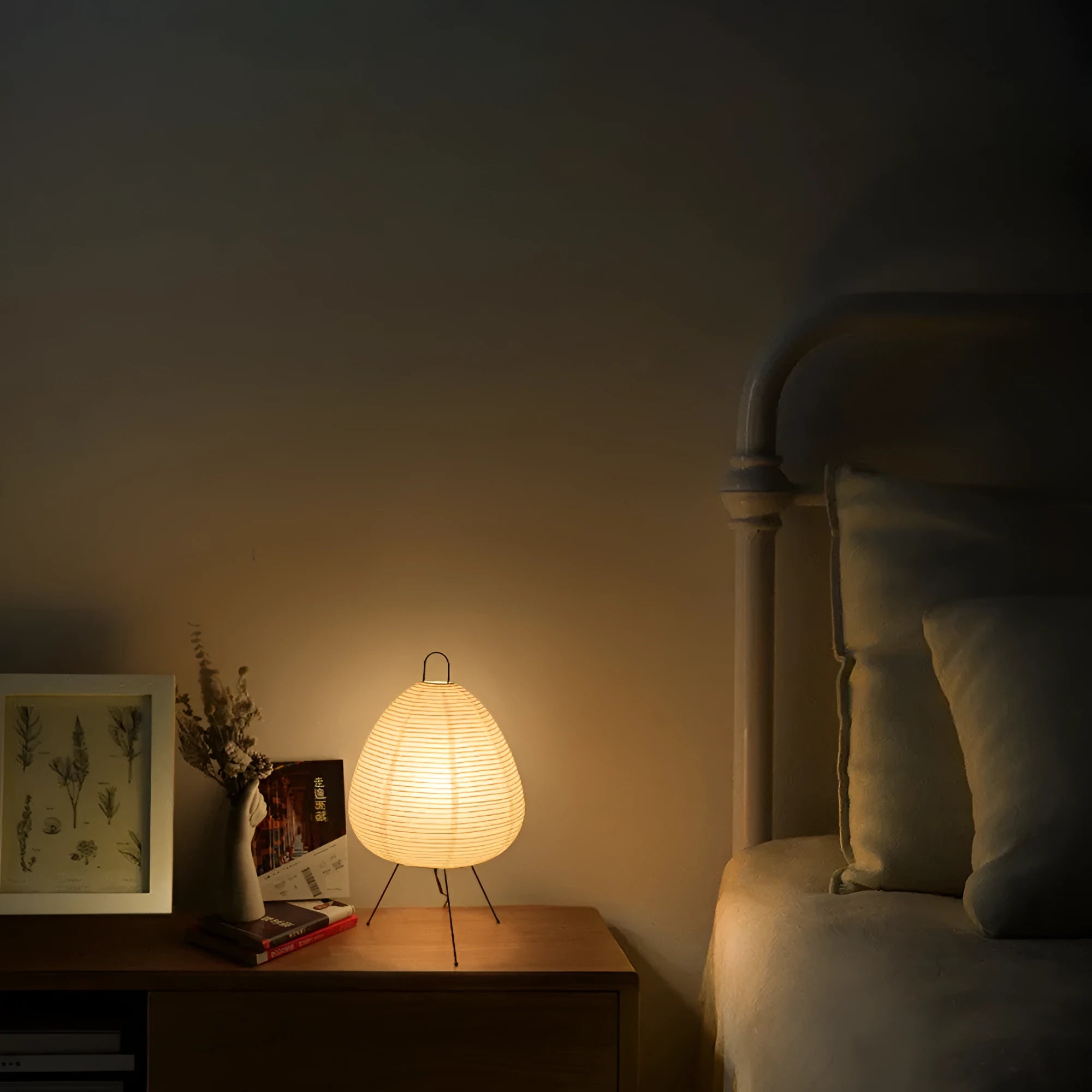 Japanese-style paper table lamp with handmade shade and aluminium base on wooden surface