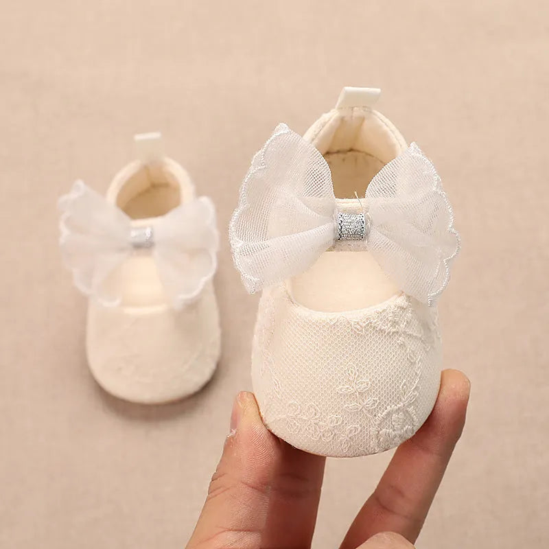 Spring baby toddler walking shoes with mesh upper, lace bow, and non-slip sole in solid colour