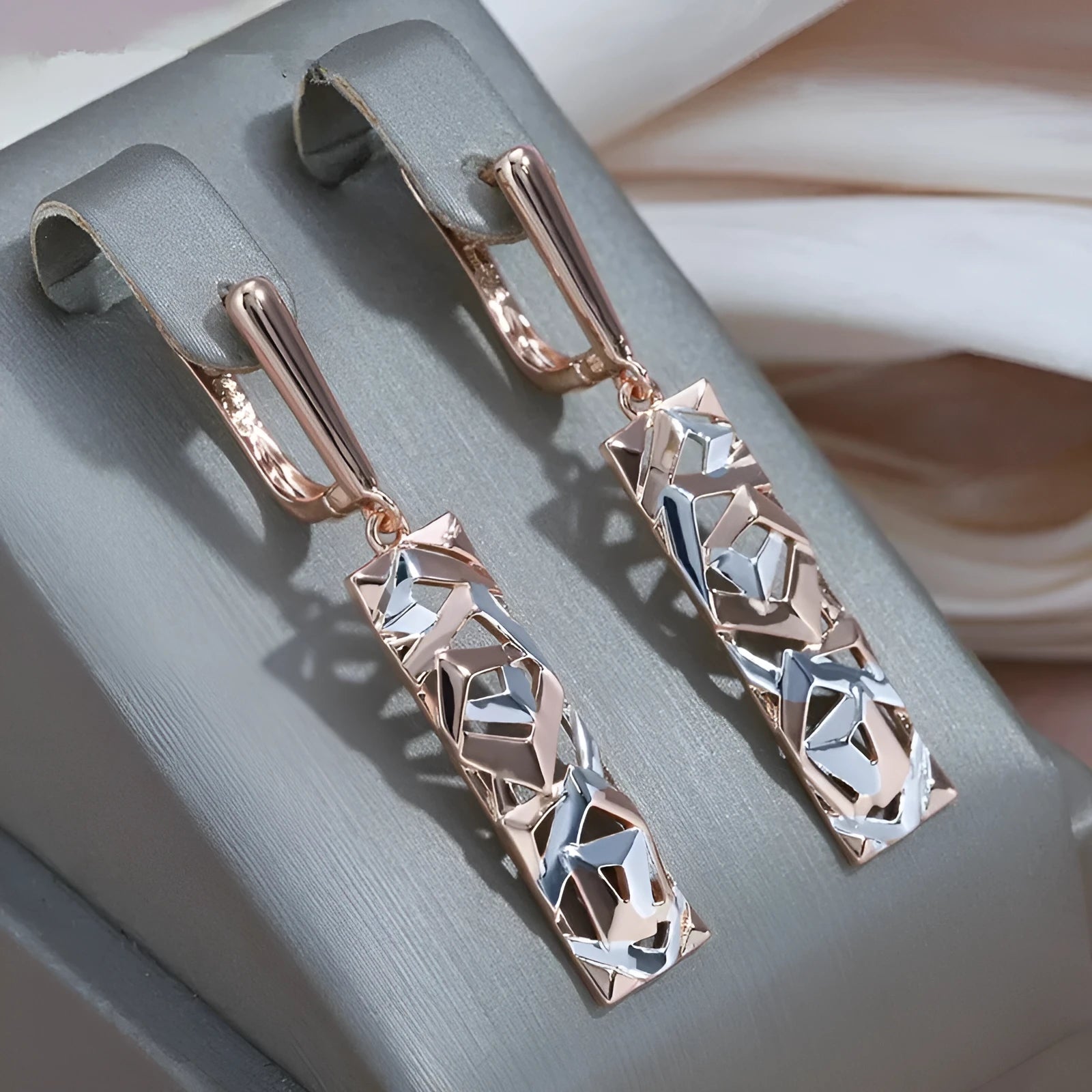 Rectangular hollow stud earrings with a two-tone colour geometric design