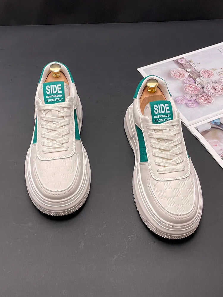 White unisex leisure shoes with cloth uppers and rubber foam soles in green or black accent colours