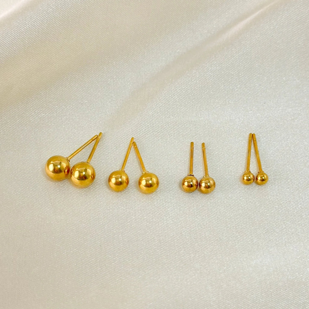 Stainless steel minimalist ball stud earrings in gold or silver, showing size comparison of 3mm, 4mm, 5mm and 6mm balls.