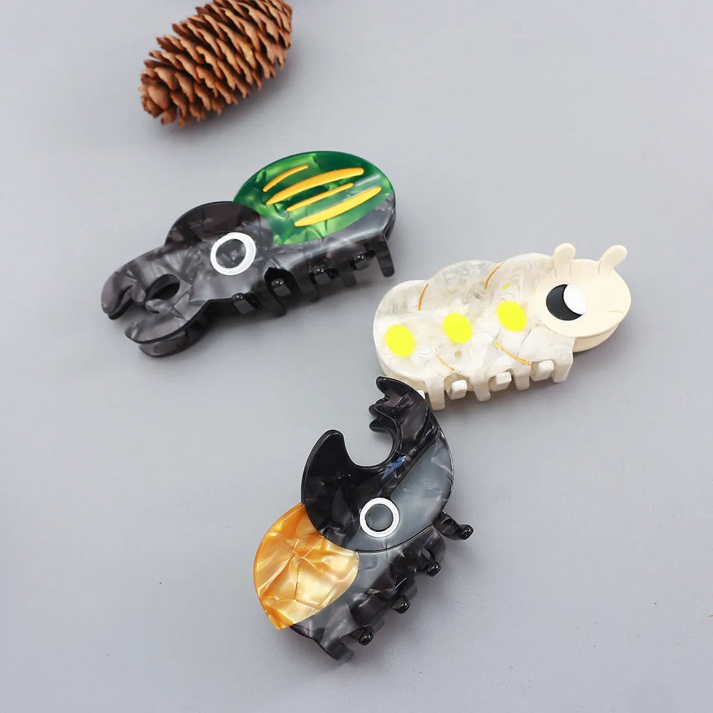 Handmade cellulose acetate beetle grip in cartoon style for insect biology observation